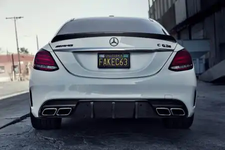 White Mercedes-Benz C63 AMG With Mode Carbon Aero Parts