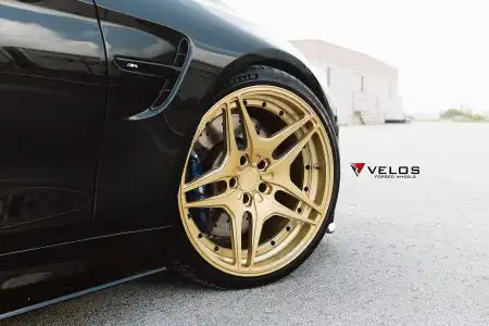 Black Sapphire Metallic BMW M4 On Gold Velos Designwerks Wheels Wallpaper