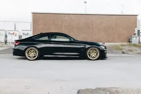 Black Sapphire Metallic BMW M4 On Gold Velos Designwerks Wheels Wallpaper