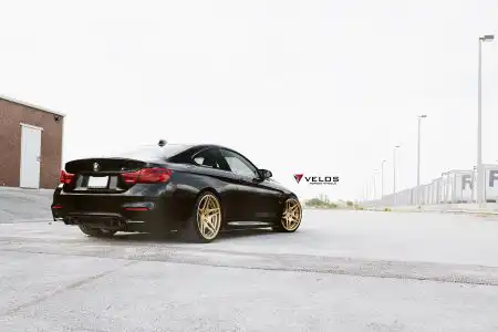 Black Sapphire Metallic BMW M4 On Gold Velos Designwerks Wheels Wallpaper