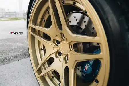 Black Sapphire Metallic BMW M4 On Gold Velos Designwerks Wheels Wallpaper