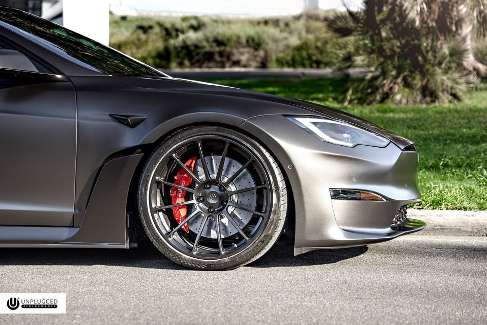 Top 6 Best Performance Upgrades for the Tesla Model S Plaid in 2026 5 Satin Black Tesla Model S S-APEX Plaid By Unplugged Performance - carbon fiber widebody, big brake kit, suspension upgrade, wheels